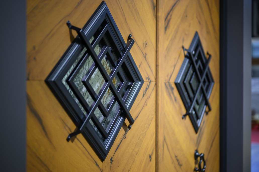 Diamond-pattern glazed inserts and metal frames on wood-effect front doors
