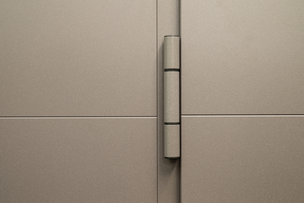 Heavy-duty concealed hinge of a security front door in the closed position
