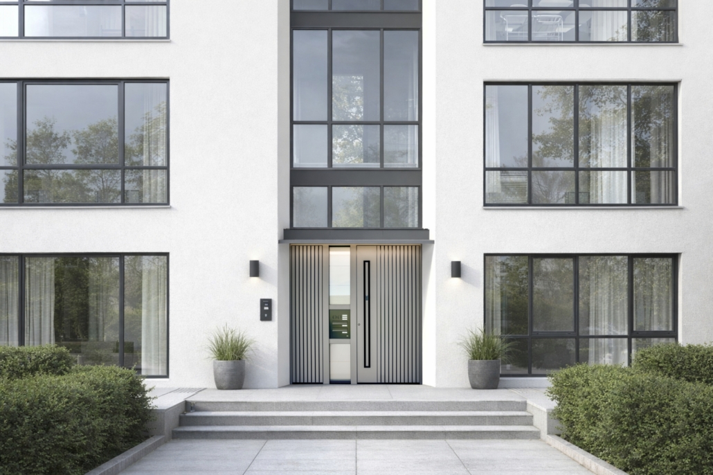 Multi-family residential building with large glazed surfaces and grey entrance doors