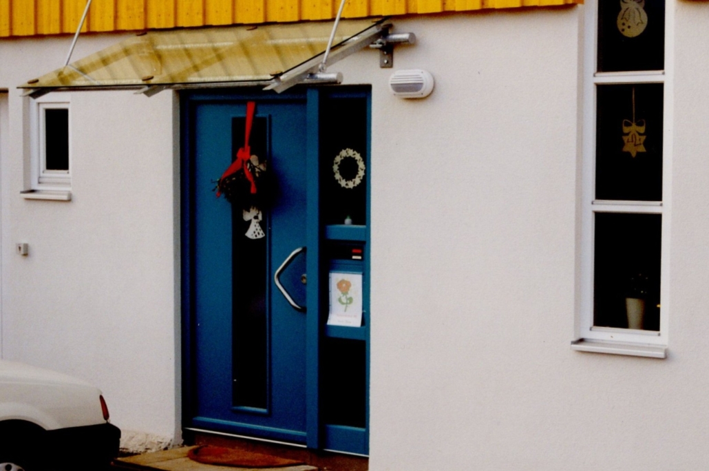 Old image of a blue entrance door