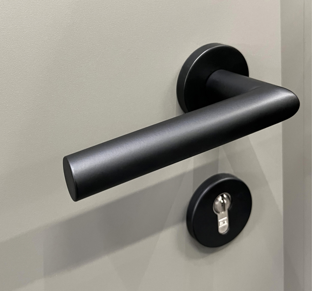 Black door handle on a grey front door