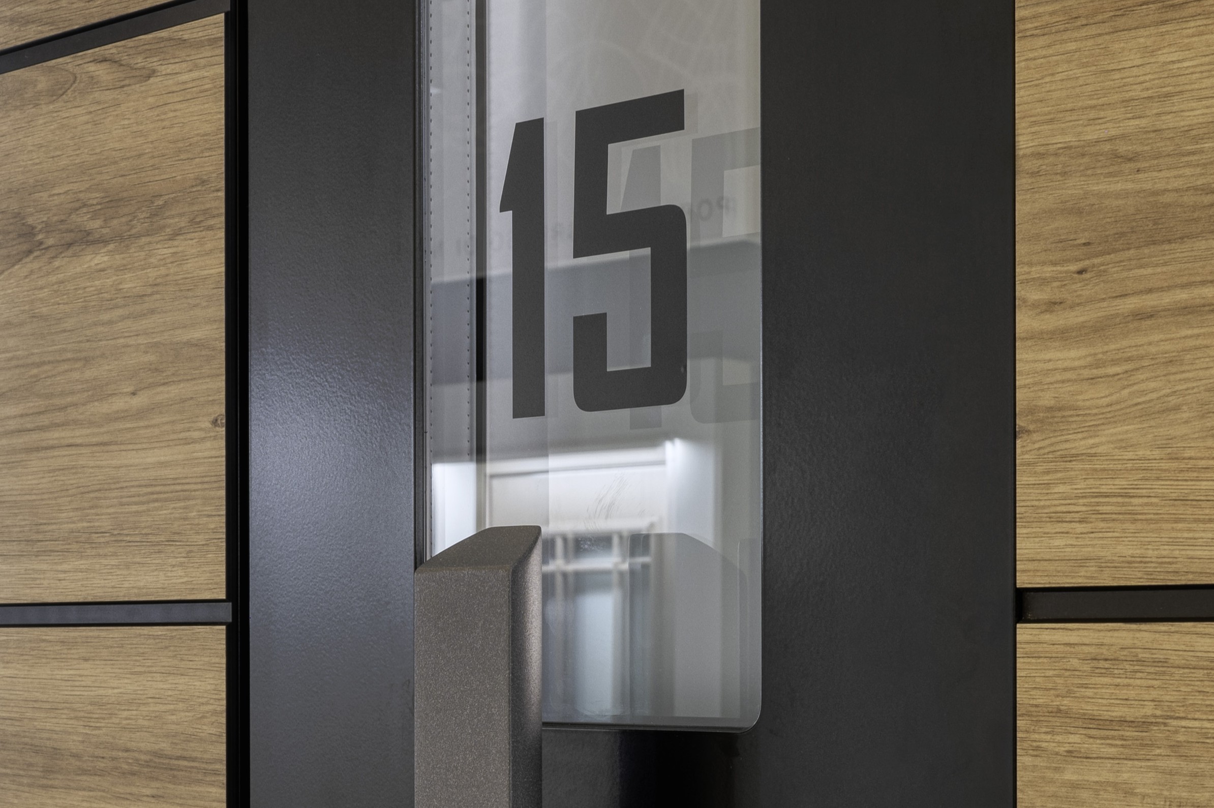 House number applied to the glazed insert of a front door